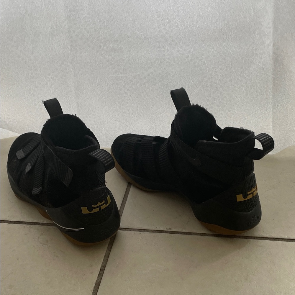 Nike Kids Black and Gold Sneakers